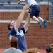 A man tosses a toddler into the air as they stand on the field at Michigan Stadium during youth at the stadium on Sunday, August 11, 2013. Melanie Maxwell | AnnArbor.com